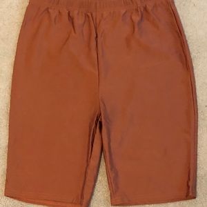 Copper coloured bike shorts. Size L, fit like an XL